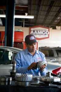Image of AAMCO Mechanic working on a Transmission